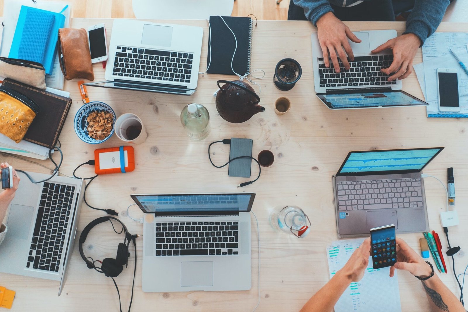 table with computers and work equipment